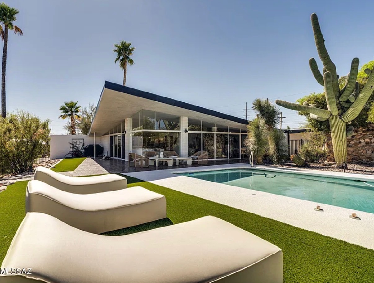 Desert home with a pool and shaded outdoor seating
